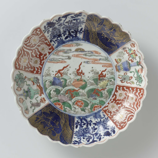 Saucer-dish with fluted sides and flowers and shellfish above waves - Anonymous