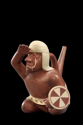 Conical-spout vessel with representation of a kneeling warrior carrying a shield and staring towards the horizon - Mochica style