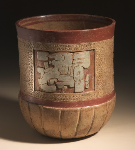 Carved and Incised Vessel with Deity Heads - Unknown