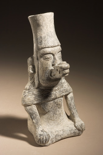 Seated Figure Wearing Serpent Mask - Unknown