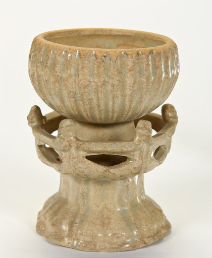 Cup with attached stand