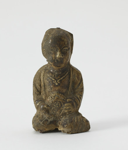 Figure of seated child