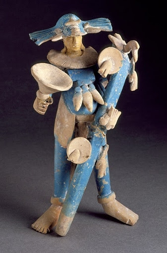 Masked Male Figure with Dance Staff - Unknown