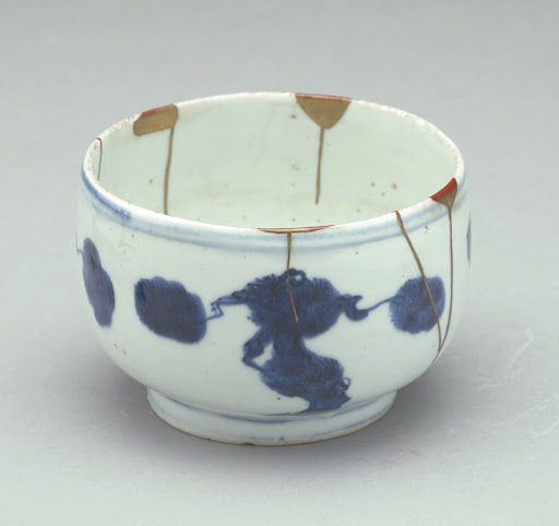 Small bowl with rounded sides, broad low foot