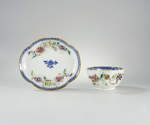 Oval, four-lobed cup and saucer with moulded flower sprays - Anonymous