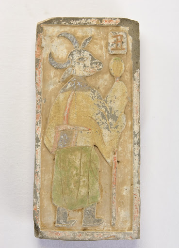 Figure with a cow's head