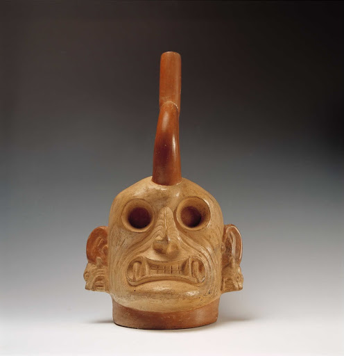 Sculptural ceramic ceremonial vessel that represents the head of Ai Apaec, mythological hero of the Moche in the underworld ML013574 - Moche style