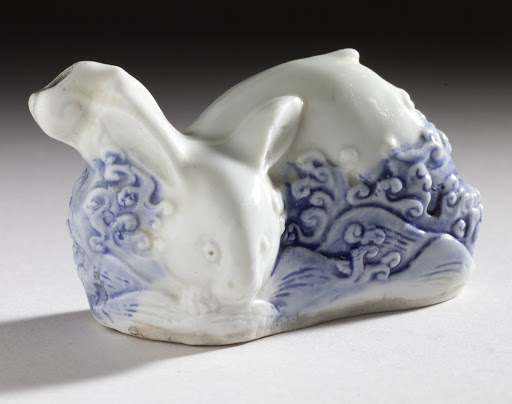 Water Dropper in the Form of a Rabbit amid Waves - Unknown