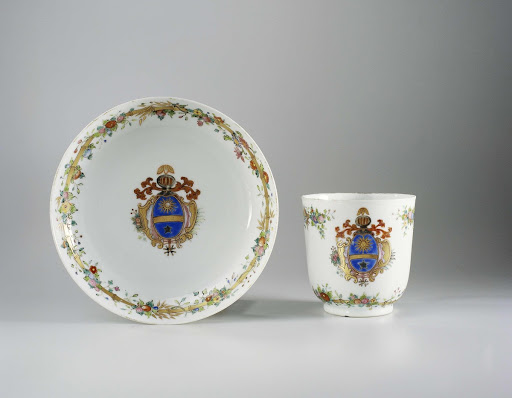 Cup with handle and saucer with a coat of arms and bamboo border with floral scrolls - Anonymous