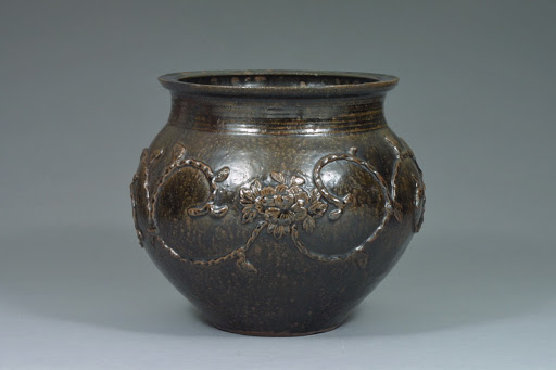 Brown jar with lotus arabesque design, Black Satsuma Ware