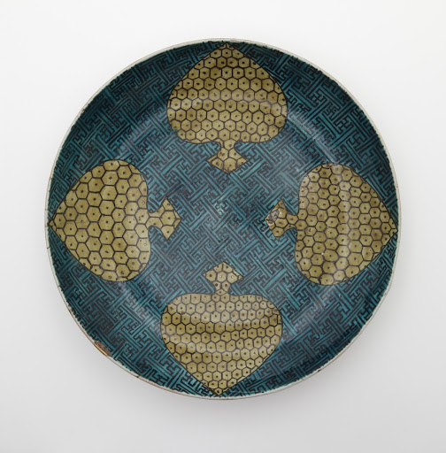 Dish with design of four spades