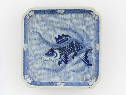 Square plate with design of carp in water weeds