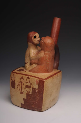 Sculptural ceramic ceremonial vessel that represents a woman masturbating an inhabitant of the underworld ML004341 - Moche style