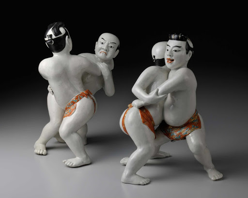 TWO FIGURINES OF SUMO WRESTLERS, Porcelain with overglaze enamels and gilt decoration - unknown