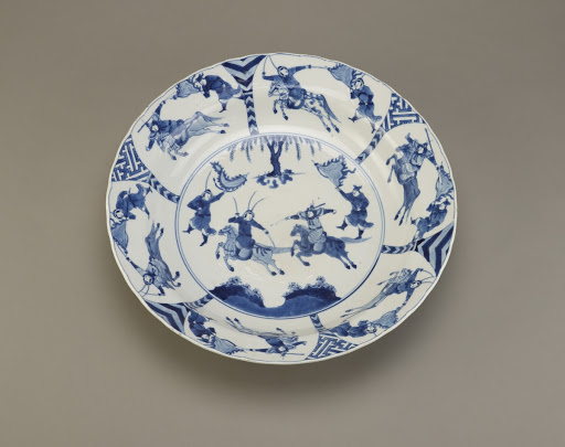 Plate with design of battling warriors, one of a pair with F1992.15.1