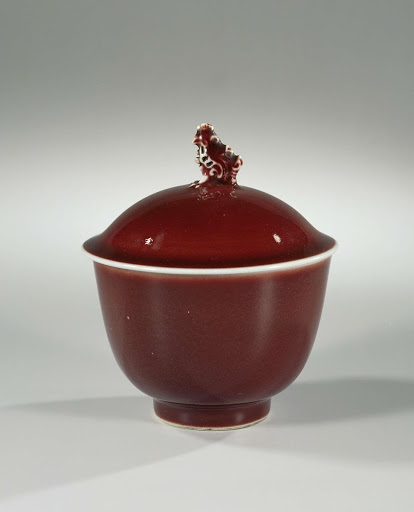 Covered jar with a red glaze and cock-shaped finial - Anonymous