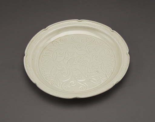 Ding ware dish with foliate rim and carved decoration of lotuses