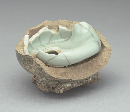 Celadon; Bowl waster (collapsed inside part of a saggar with kiln debris adhering)