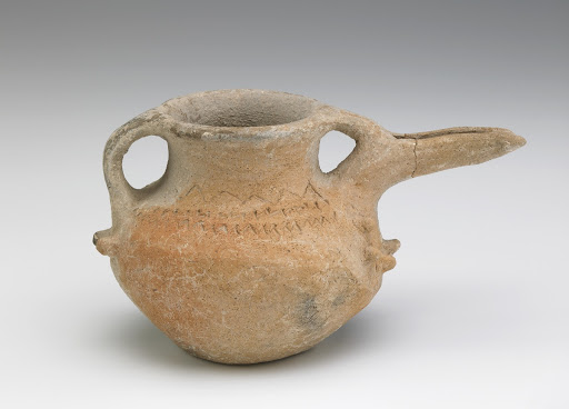 Spouted vessel with loop handle