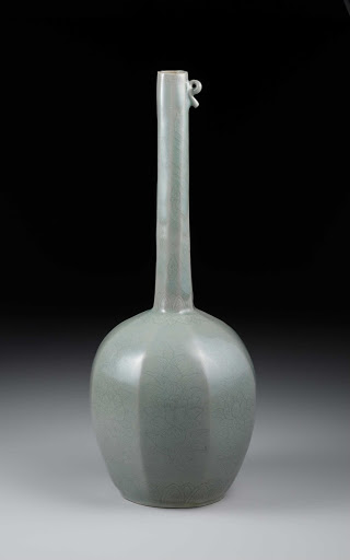BEVELED LONG-NECKED VASE, Celadon with carved and incised peony and lotus design - unknown