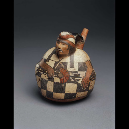 Spouted vessel with strap handle in the form of a seated man with a moustache and small goatee - Middle Nasca