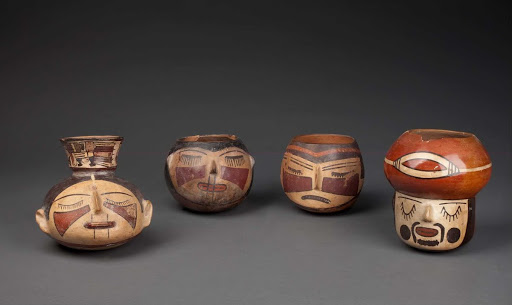 Sculptural ceramic ceremonial vessel that represents a head offering (left) ML040372 - Nasca style