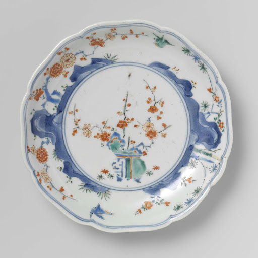 Scalloped dish with flowerpot, rocks, birds, bamboo and prunus - Anonymous