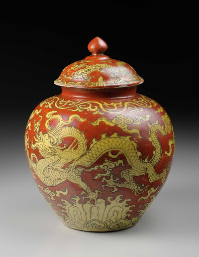 COVERED JAR, Porcelain with dragon design in overglaze yellow enamel on red ground - unknown