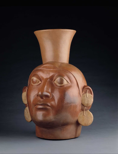 Sculptural ceramic ceremonial vessel that represents the head of a captive warrior ML012869 - Moche style