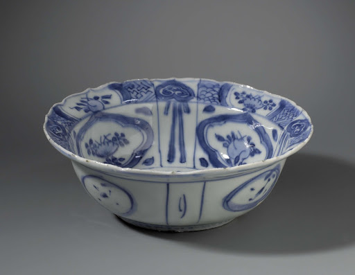 Klapmuts bowl with insects near flowering plants - Anonymous