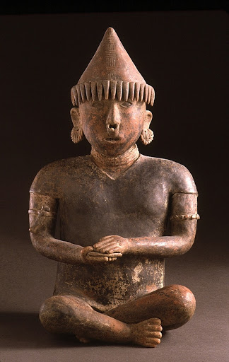 Seated Male Figure with Fringed Headdress - Unknown