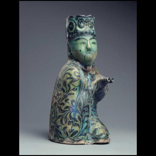 Molded vessel: seated man holding a water skin - Persian