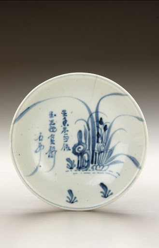 Dish with poem and design of orchid and rock