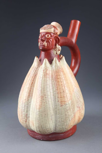 Sculptural ceramic ceremonial vessel that represents Ai Apaec, mythological hero of the Moche emerging from a corn cob ML003291 - Moche style