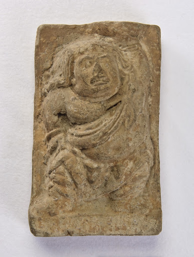 Tile with relief of dwarf