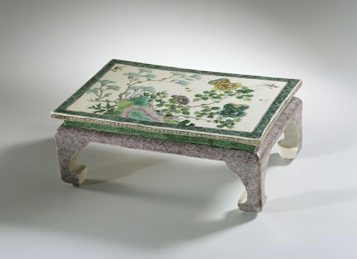 Stand shaped like a miniature table with flowering plants - Anonymous