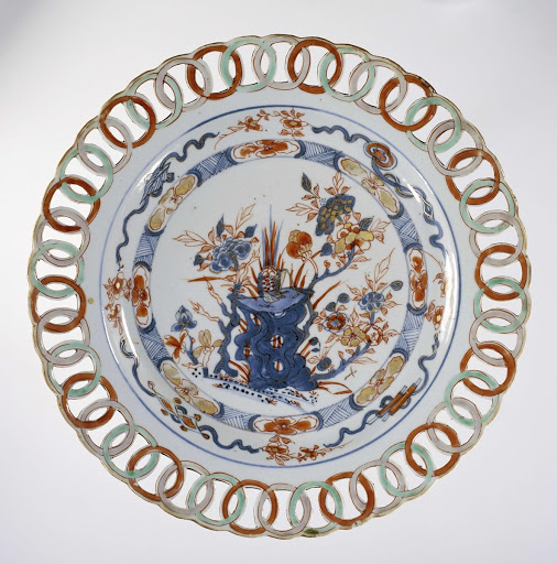 Dish with pheasant, flowering plants and precious objects, rim composed of interlocking open rings - Anonymous