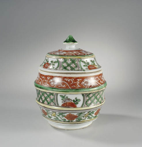 Barrel-shaped covered jar with flower scrolls and geometric patterns - Anonymous