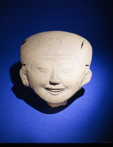 Head fragment with smiling face - Anonymous