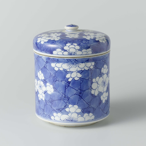 Cylindrical covered jar with flower-heads in reserve - Anonymous