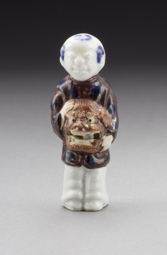 Netsuke in the Form of a Standing Chinese Child with a Lion Mask - Unknown