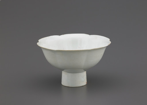 Cup with foliate rim and high foot