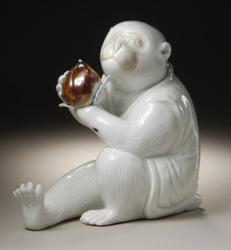 Costumed Monkey Holding a Peach - Unknown