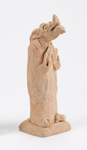 Standing figure with dog's head