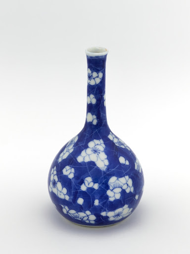 Vase with blossoming prunus and cracked ice pattern