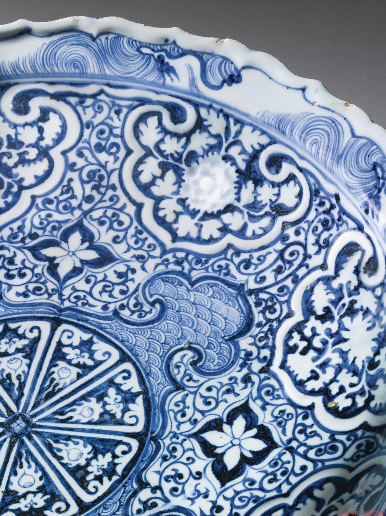 Sothebys:PROPERTY FROM A PRIVATE COLLECTION A RARE MOLDED BLUE AND WHITE BARBED RIM DISH YUAN DYNASTY, 14TH CENTURY Estimate   200,000 — 300,000  USD  LOT SOLD.	4,197,000 USD