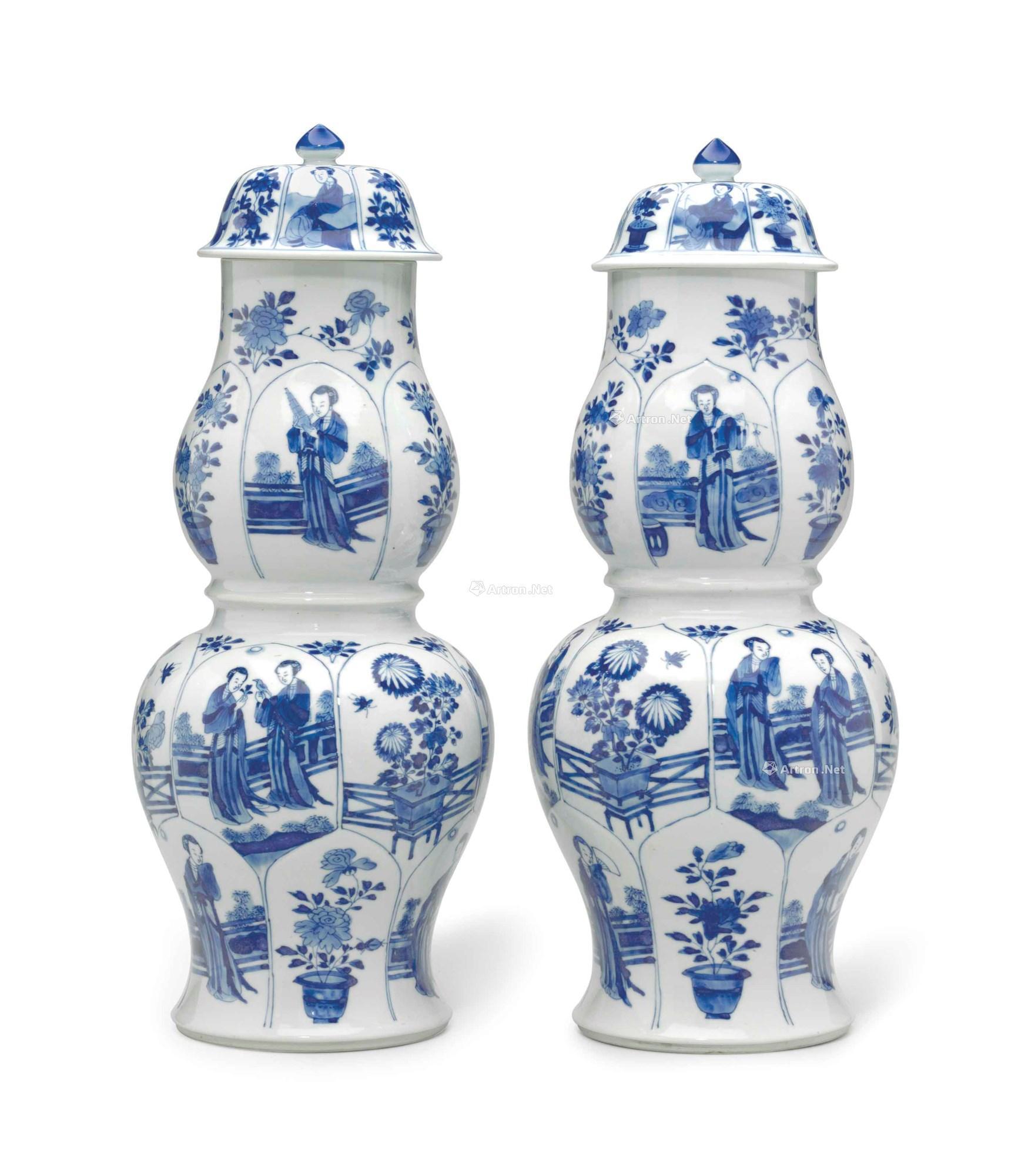 Kangxi period, 1662-1722, A LARGE PAIR OF BLUE AND WHITE MOLDED DOUBLE GOURD VASES AND COVERS