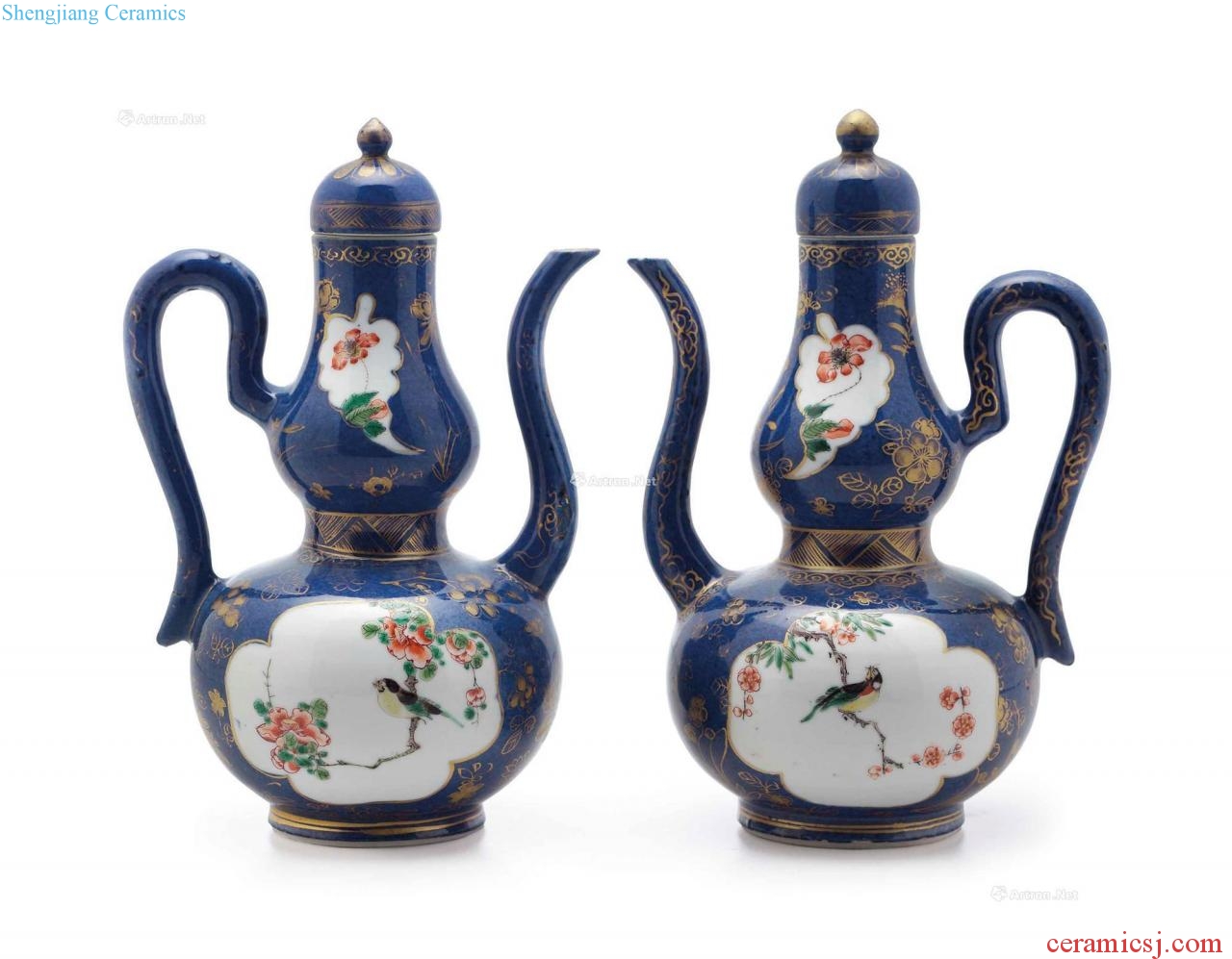 Kangxi period, 1662-1722 - A PAIR OF BLUE - GROUND FAMILLE VERTE DOUBLE - GOURD EWERS AND COVERS