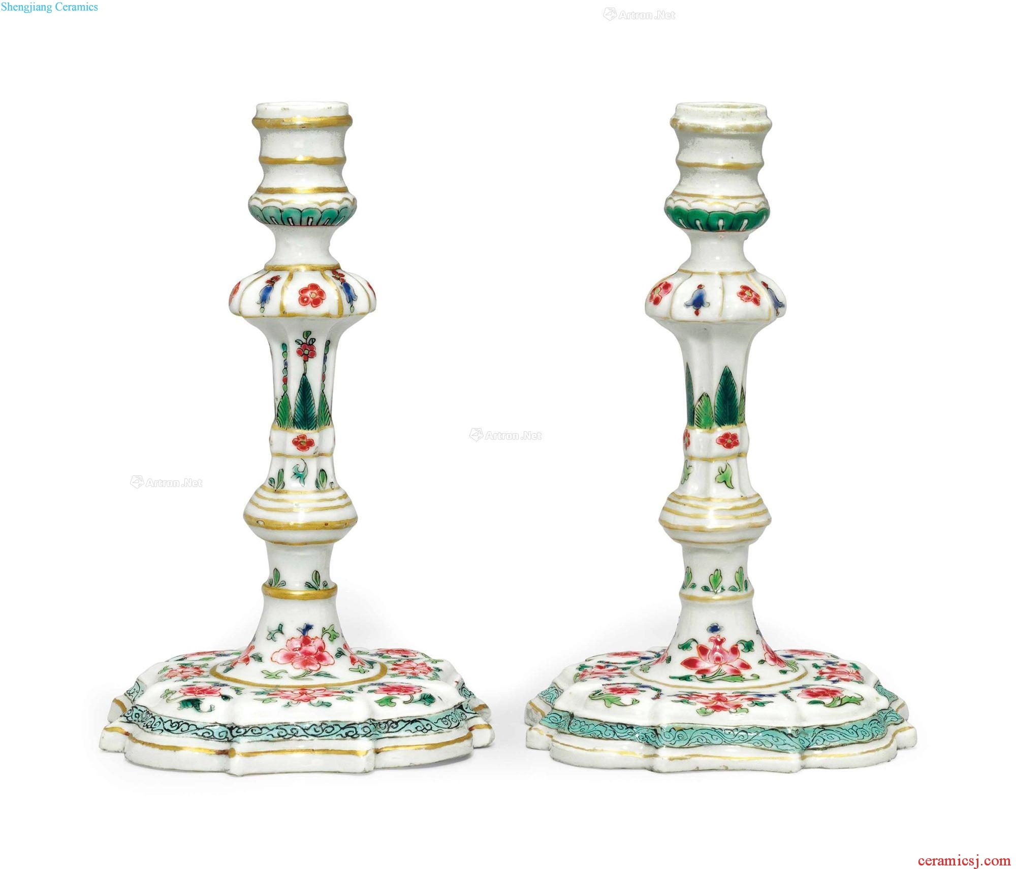 Qianlong period, about 1740 A PAIR OF FAMILLE ROSE CANDLESTICKS