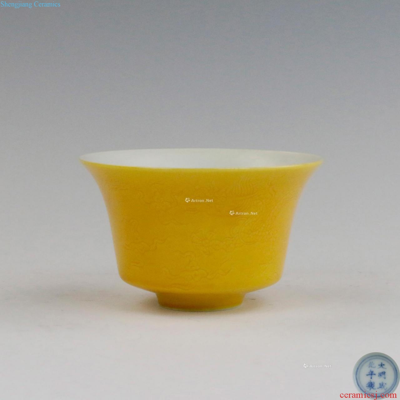 Bright yellow glaze, dark carved dragon cup